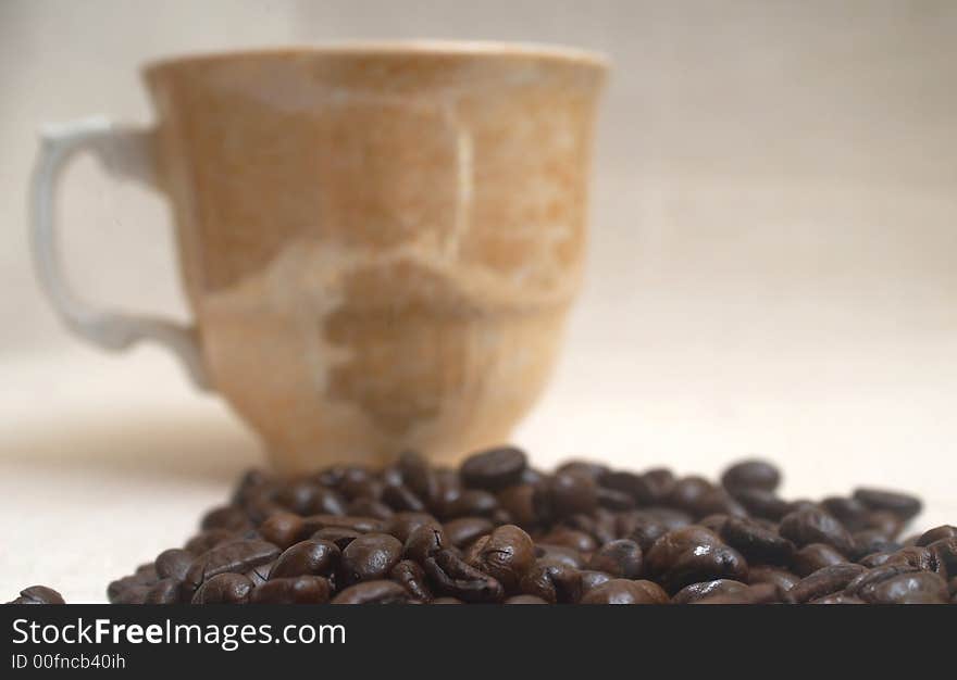 Still life of coffee grains and pieces of service. Still life of coffee grains and pieces of service