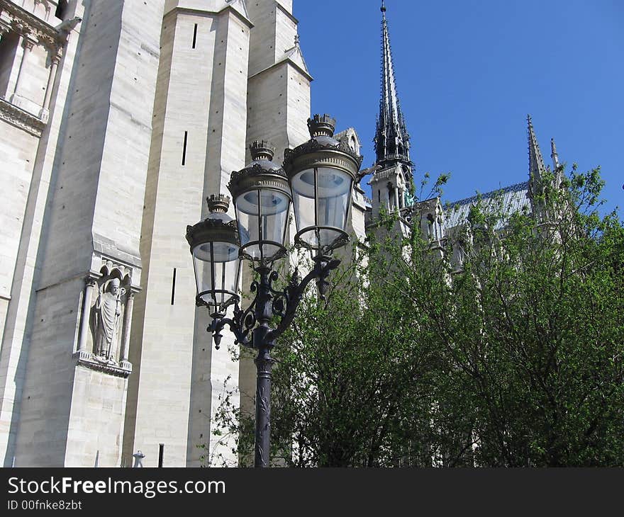 From the side of notre-dame de paris, scupture and gothic architecture. From the side of notre-dame de paris, scupture and gothic architecture