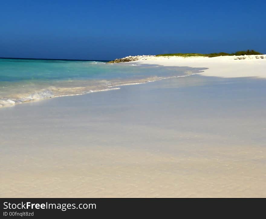 Wonderful white beach in trpoical island under blue sky. Wonderful white beach in trpoical island under blue sky