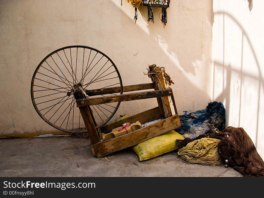 Old spinning wheel used to make fabrics in Marrakech. Old spinning wheel used to make fabrics in Marrakech