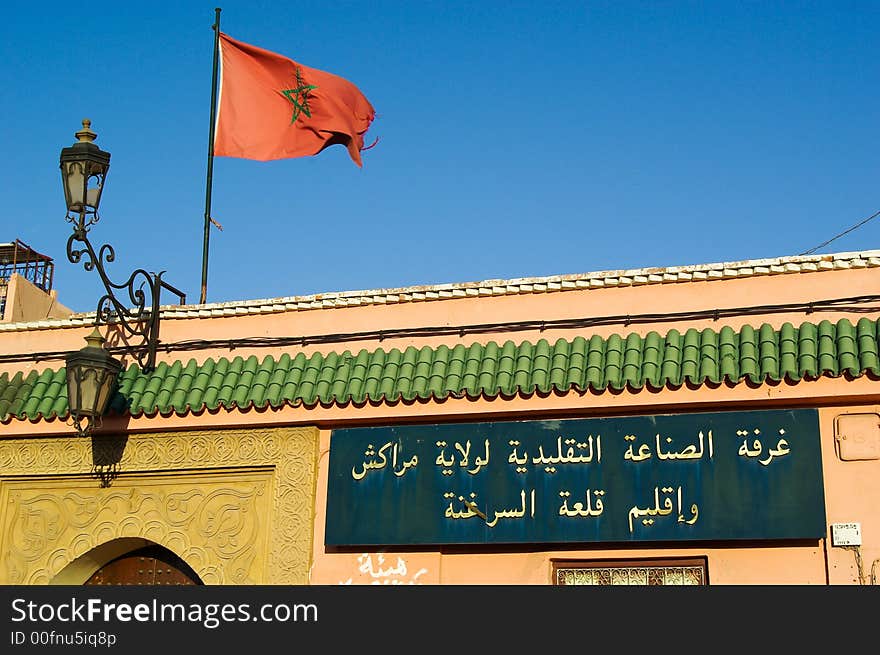 Palace with moroccan flags in djema el fna square, Marrakech