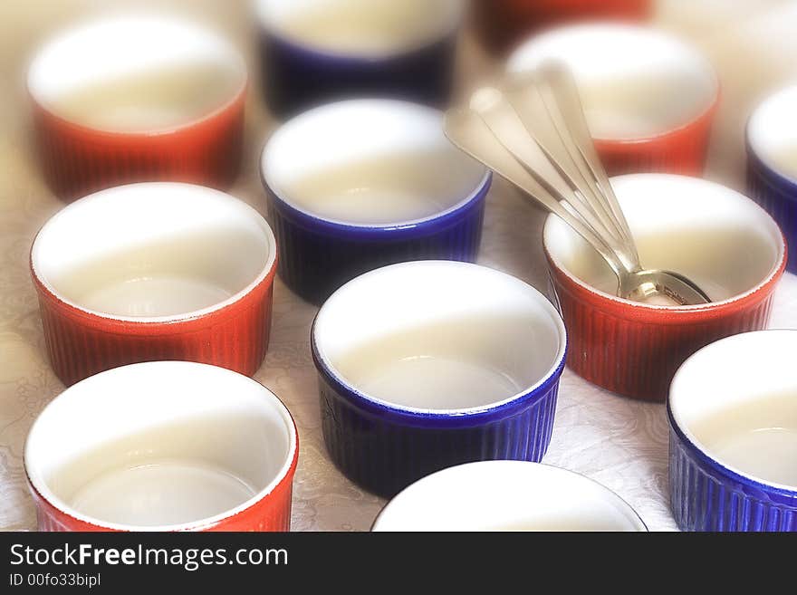 Typical food container of the french cuisine with teaspoons. Typical food container of the french cuisine with teaspoons