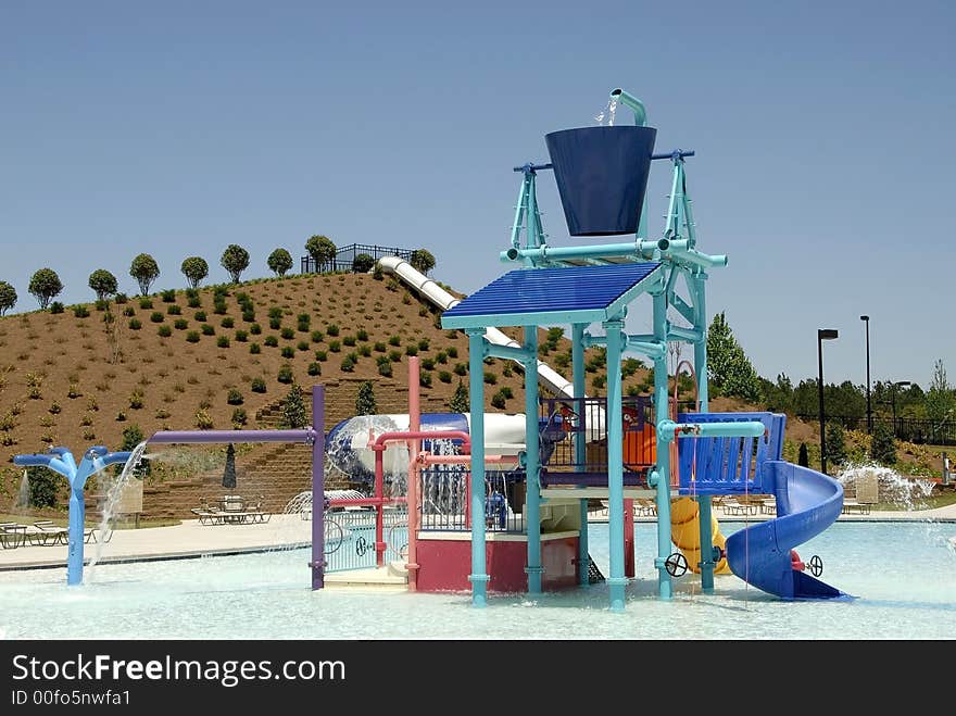 A swimming pool area with a waterpark for children. A swimming pool area with a waterpark for children