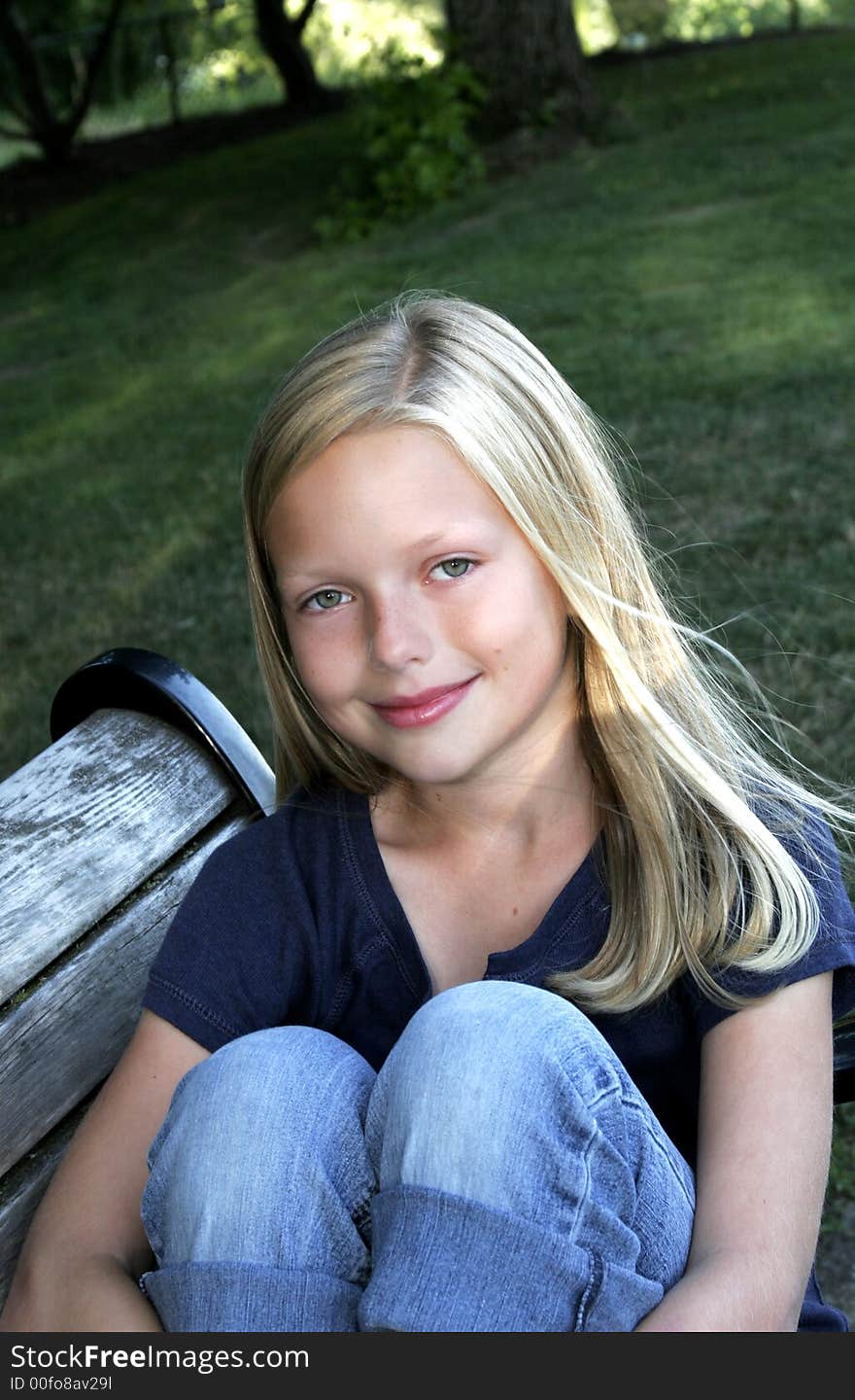 Image of a preteen girl in  park setting. Image of a preteen girl in  park setting