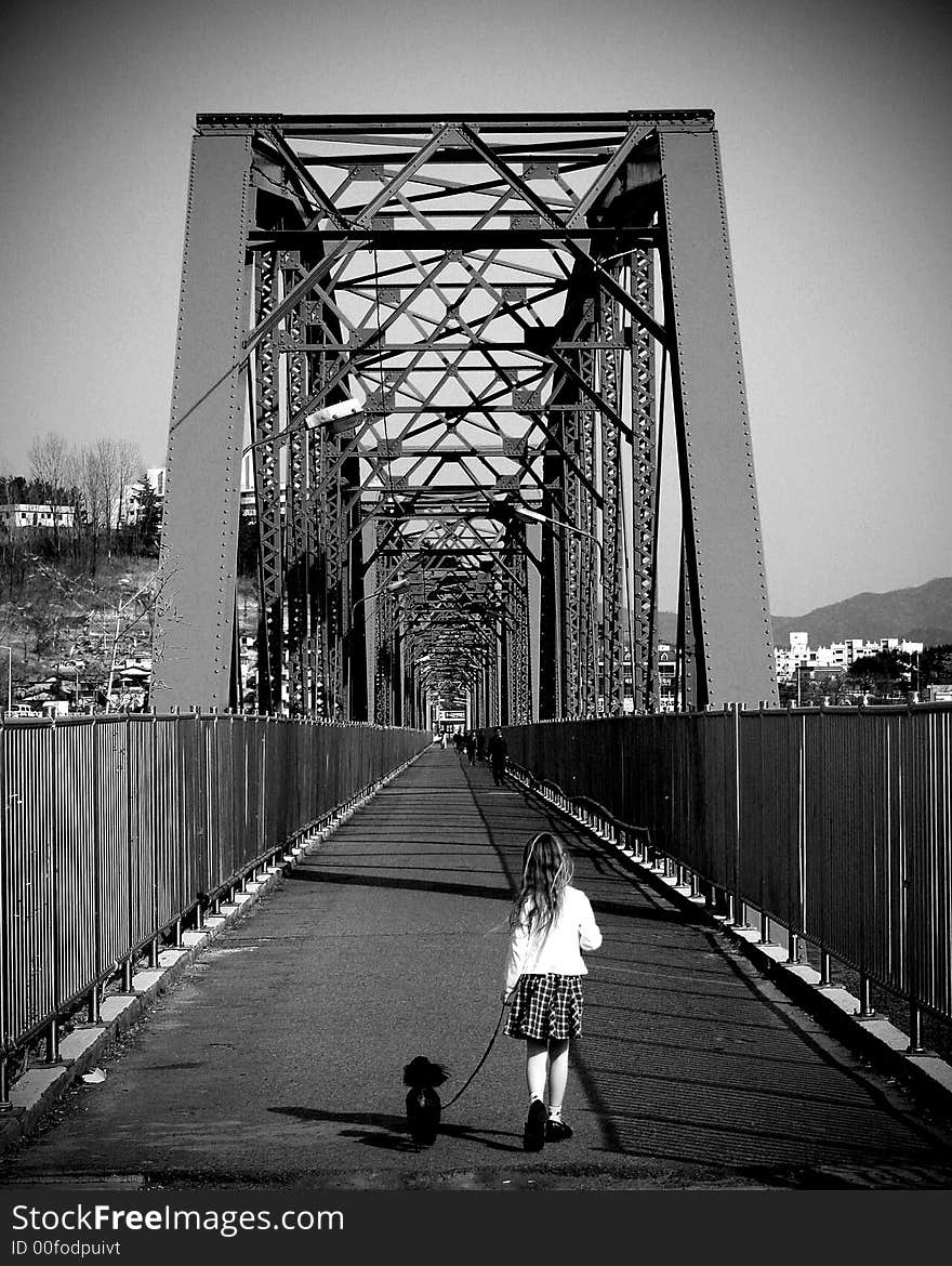 Waegwan, South korea
Our daughter and our poodle croosing a bridge. Waegwan, South korea
Our daughter and our poodle croosing a bridge