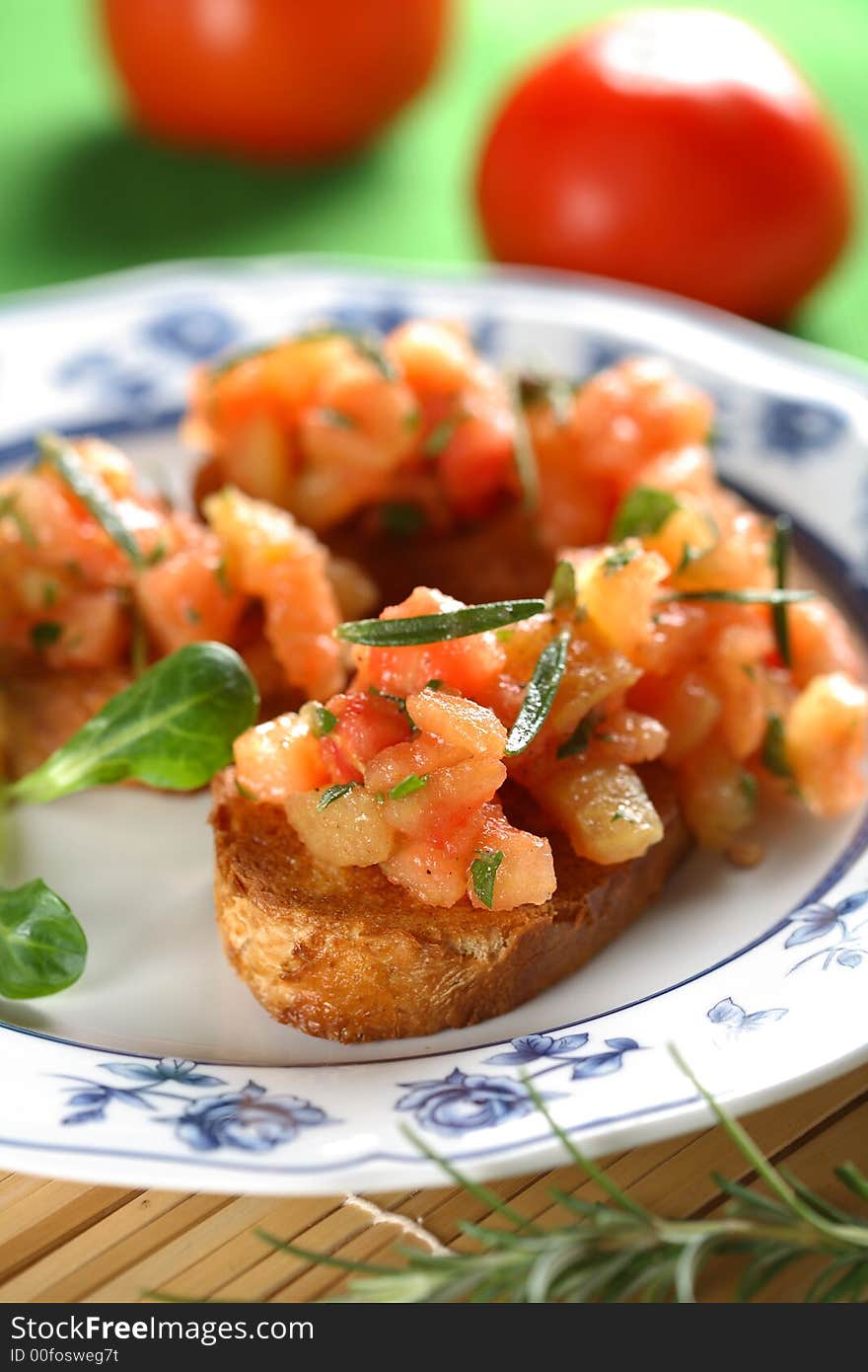 Casserole with tomatoes on the oven bread