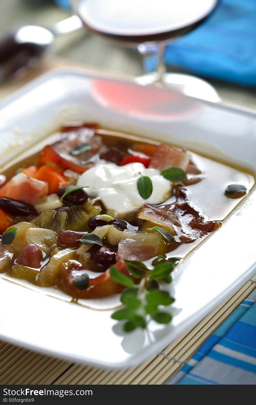 Soup with smoked bacon and fresh vegetables