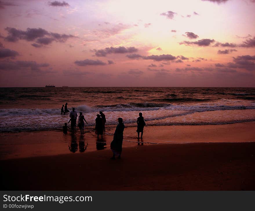 Crowd forming silhouettes at the beach. Crowd forming silhouettes at the beach.