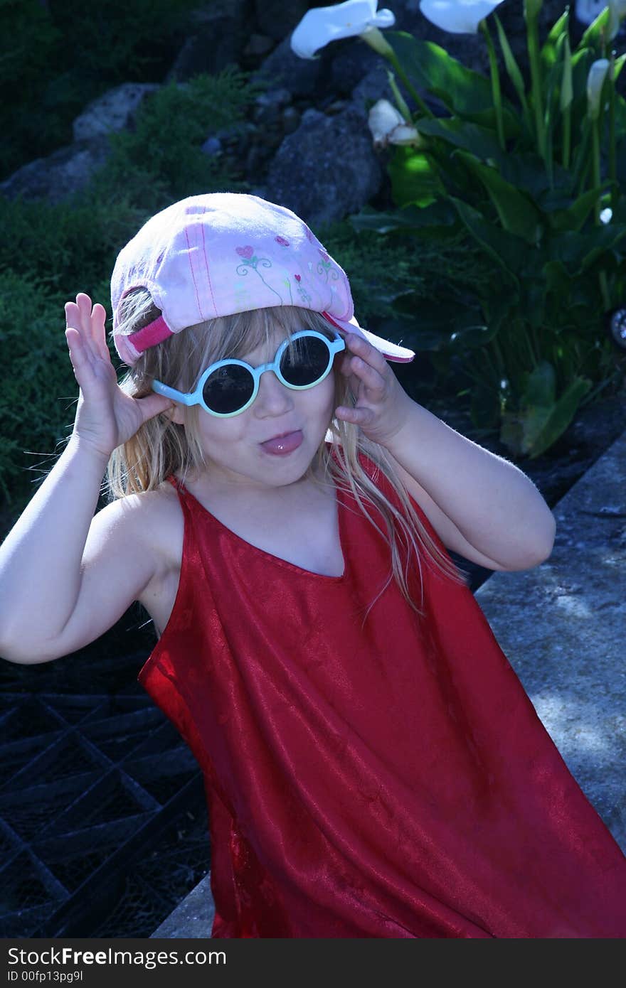 YOung girl pulling a face whilst dressed in an unusual fashion. YOung girl pulling a face whilst dressed in an unusual fashion