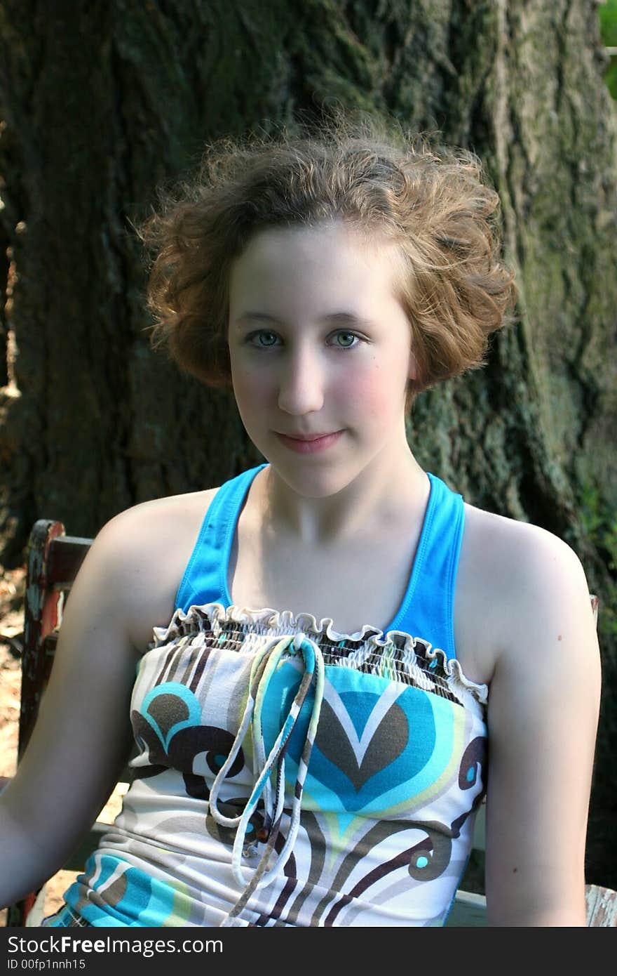 Image of a young teen girl with her hair blowing in the breeze. Image of a young teen girl with her hair blowing in the breeze