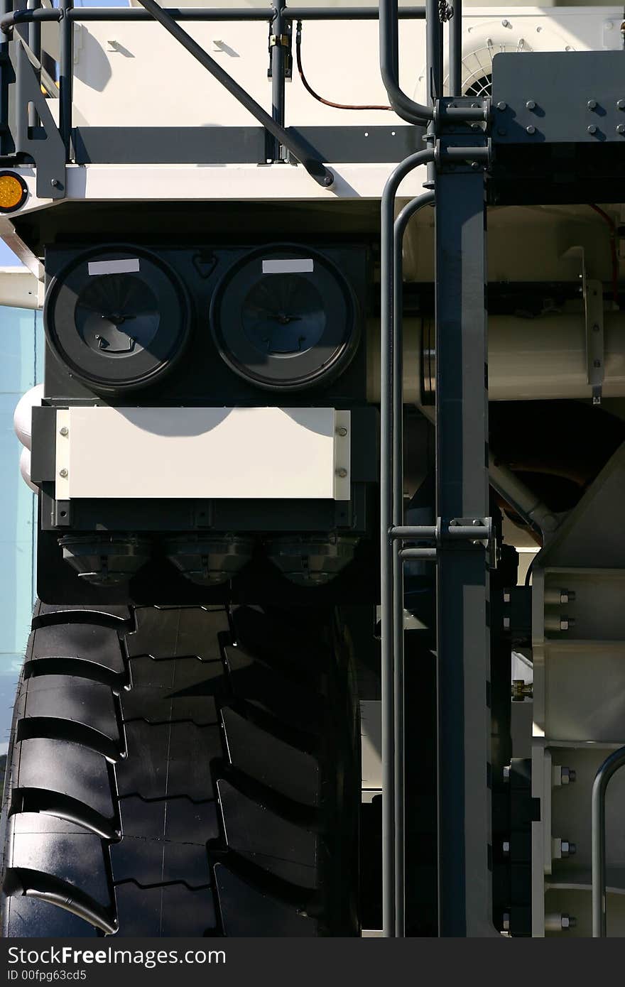 Close up at fragment of a big dump truck. Close up at fragment of a big dump truck