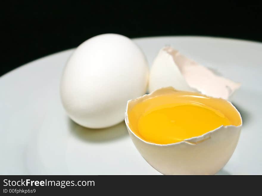 Chicken eggs on black background