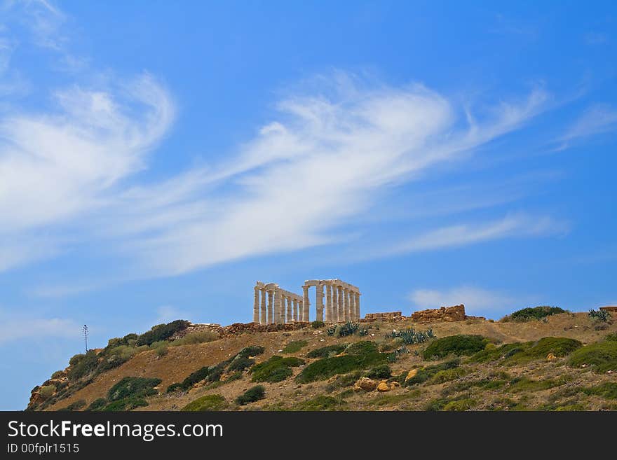 Poseidon temple, with Greek blue sky and amazing cloudscape. Poseidon temple, with Greek blue sky and amazing cloudscape.