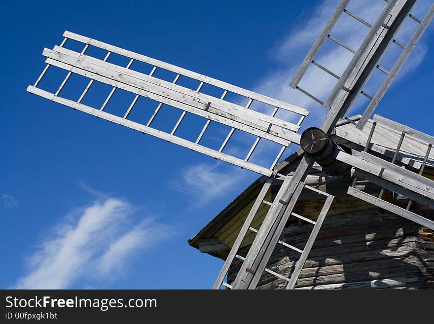 Old wooden windmill at blue sky. Russia. Old wooden windmill at blue sky. Russia