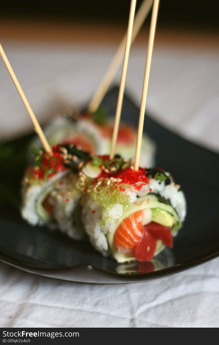 Sushi Roll sliced and skewered individually. Sushi Roll sliced and skewered individually