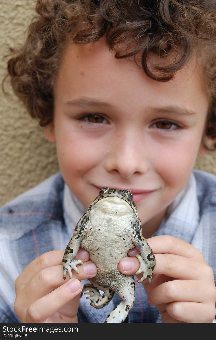 Boy holding CA native toad