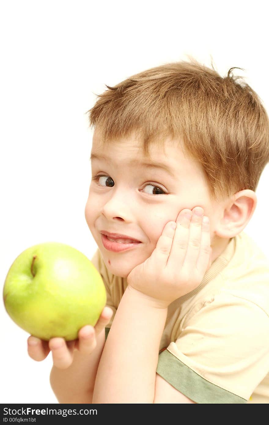 Sight of the boy with a green apple in a hand