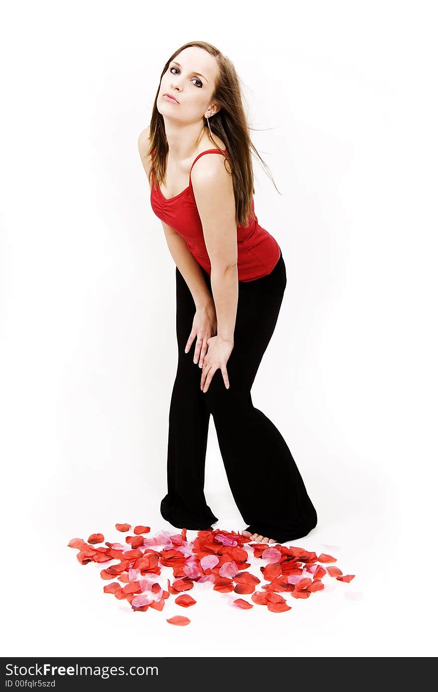 Beautiful young woman blowing kisses on white background