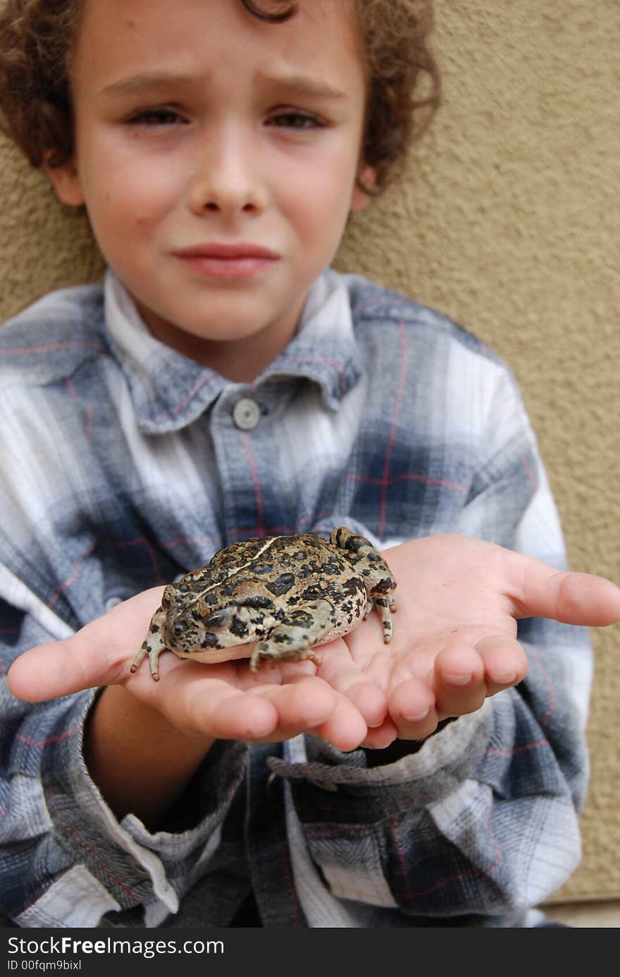 Boy holding CA native toad