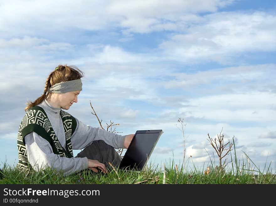 Woman with notebook at nature