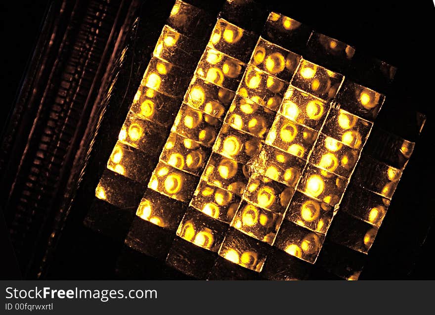 Abstract amber-coloured structure, black background. Abstract amber-coloured structure, black background