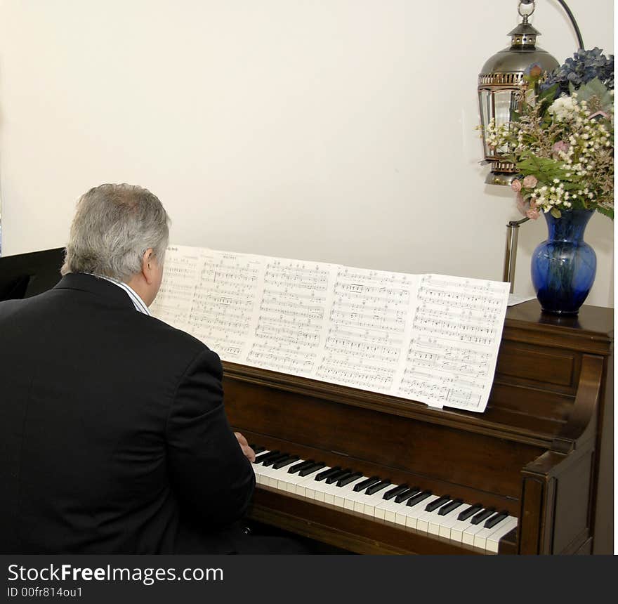 A pianist is playing for a singer. A pianist is playing for a singer