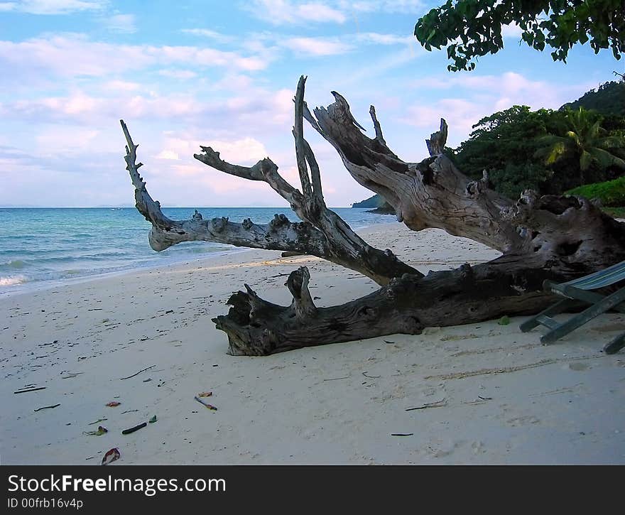 A view from Laem Ton beach in Koh Phi Phi Don, Thailand. The peaceful Indic ocean bathes the shore. A view from Laem Ton beach in Koh Phi Phi Don, Thailand. The peaceful Indic ocean bathes the shore.