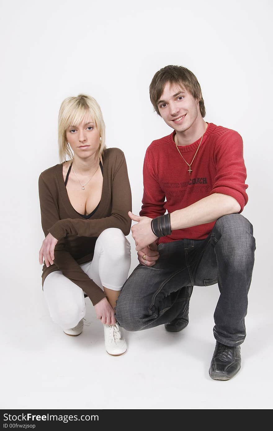 Two young students on white background