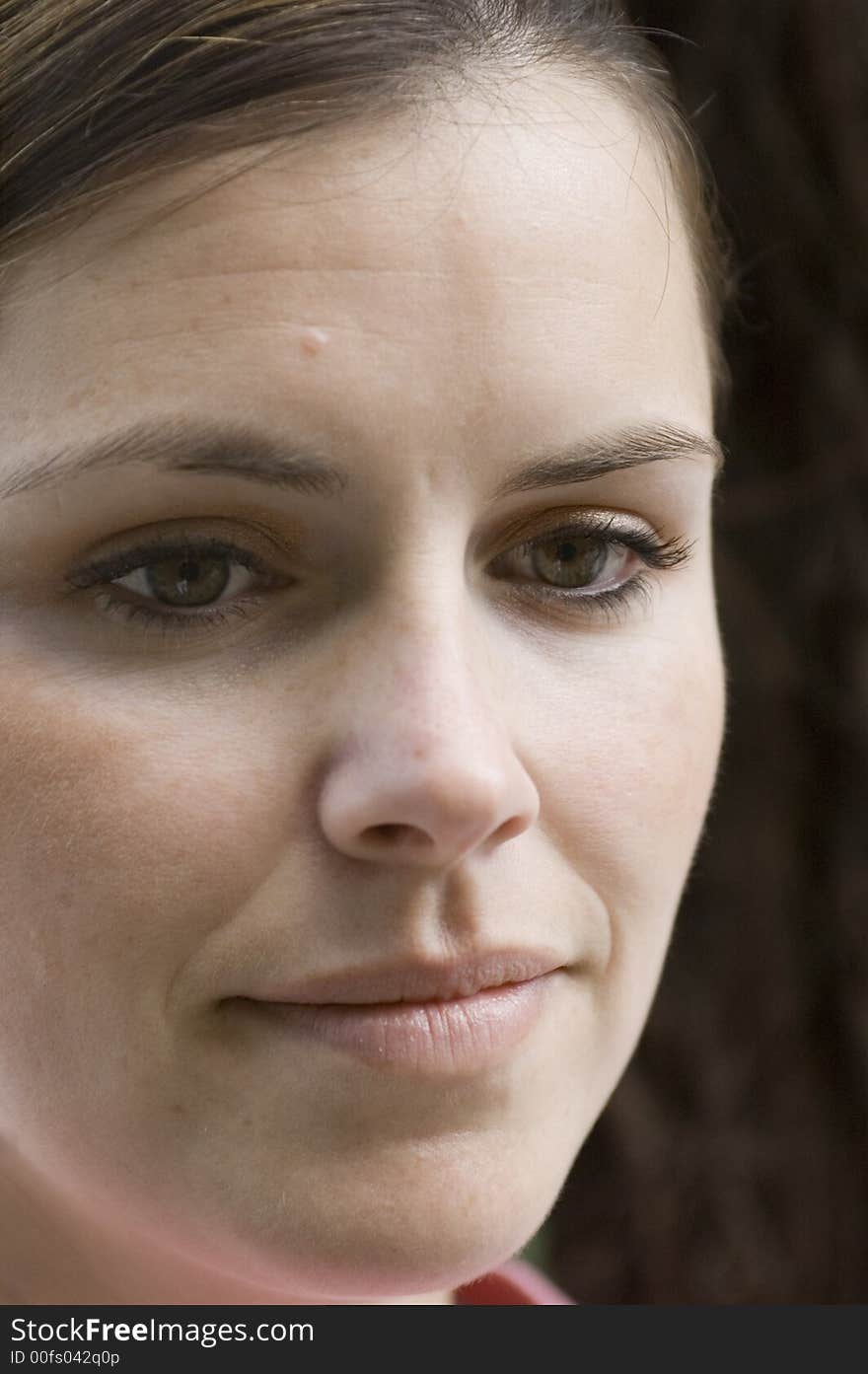 A lady's face shot with dark background. A lady's face shot with dark background