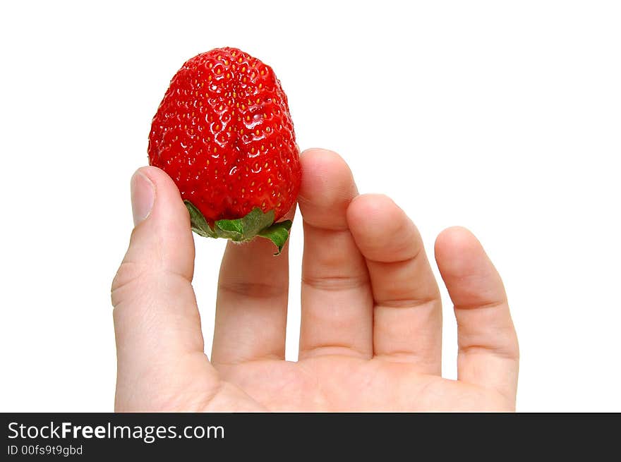 Strawberry in a hand on a white background