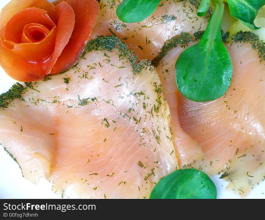 Salmon marinated with dill, rose made of tomato