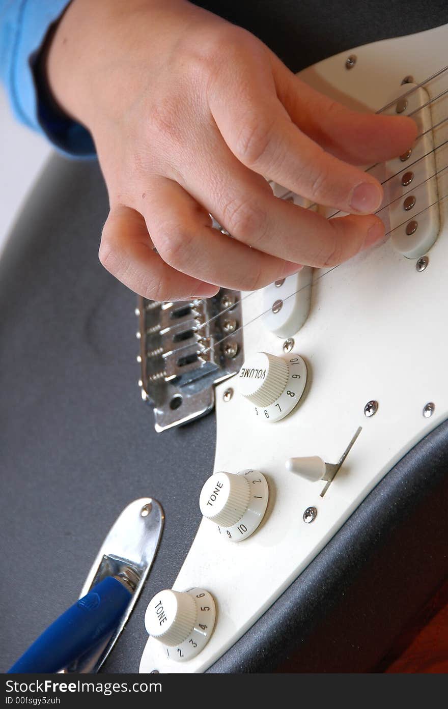 Playing guitar-closeup