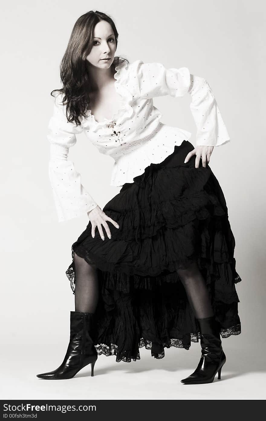 Portrait of a woman in front of a white background in a studio environment. Portrait of a woman in front of a white background in a studio environment