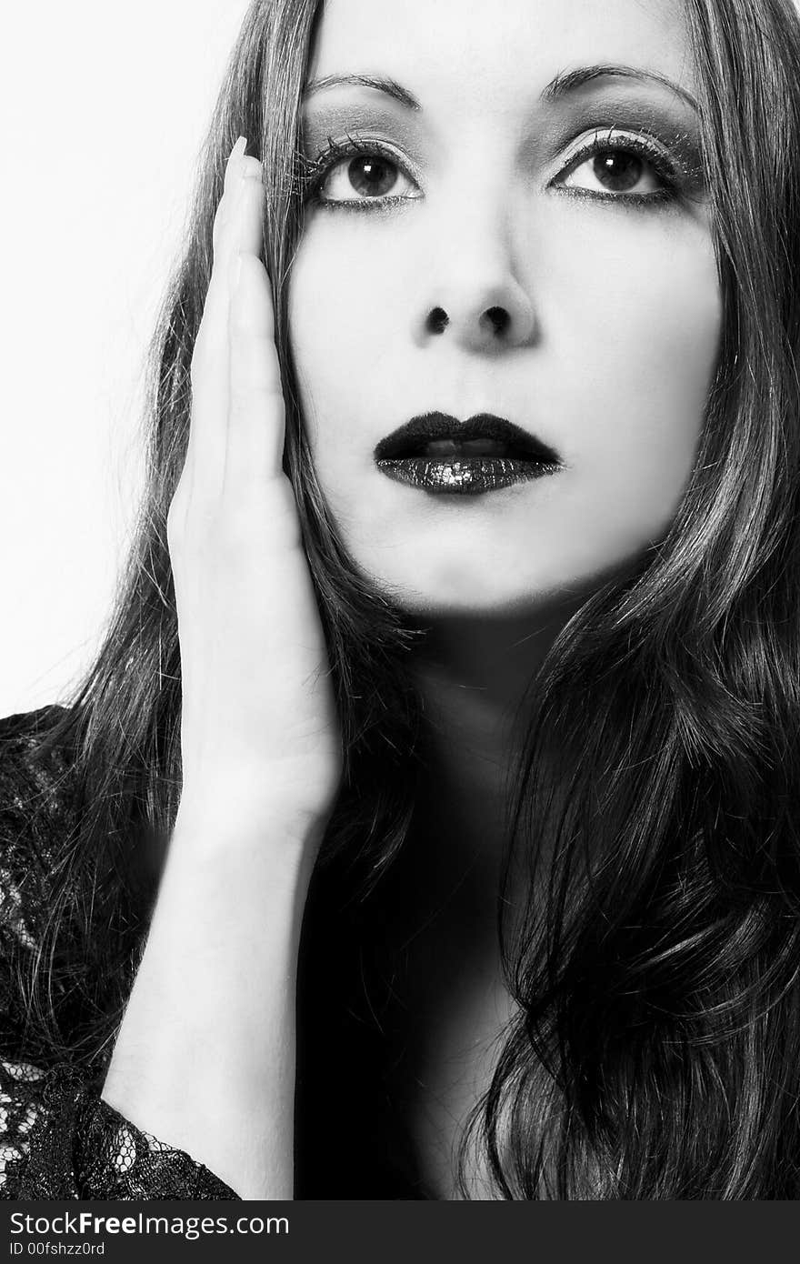 Portrait of a woman in front of a white background in a studio environment. Portrait of a woman in front of a white background in a studio environment