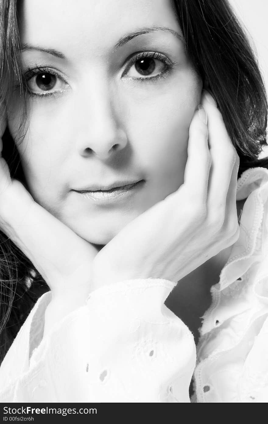 Portrait of a woman in front of a white background in a studio environment. Portrait of a woman in front of a white background in a studio environment