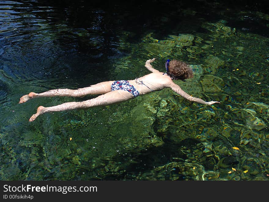 Women snorkeling in a tide pool