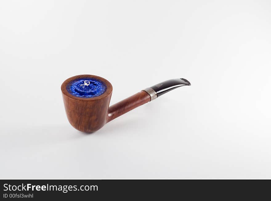 A tobacco pipe with a some of water. A tobacco pipe with a some of water