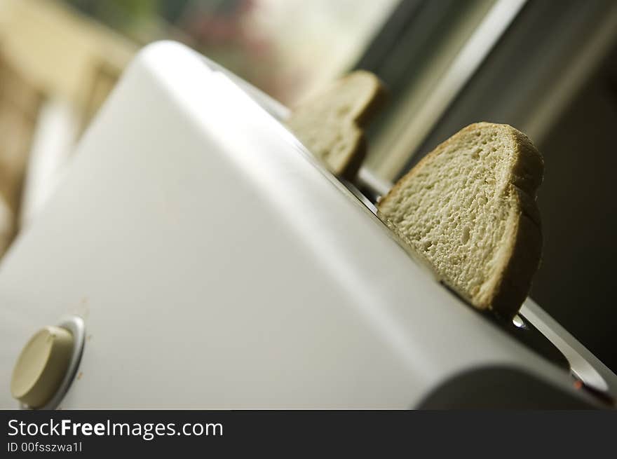 Home toaster close-up with two pieces of bread