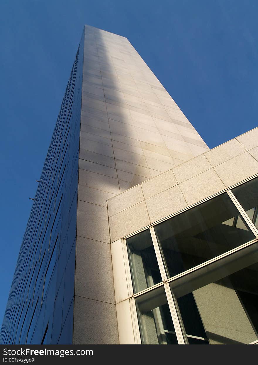 Downtown impressive tower on a deep blue sky background. Downtown impressive tower on a deep blue sky background