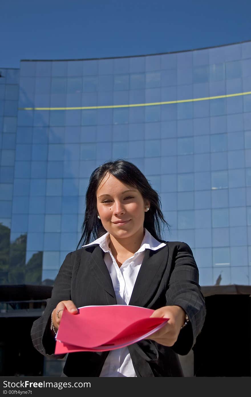 Businesswoman downtown holding a file