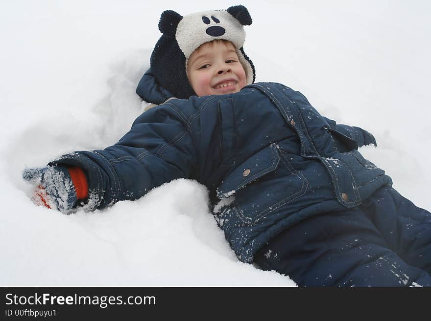 The Boy Lays On A Snow