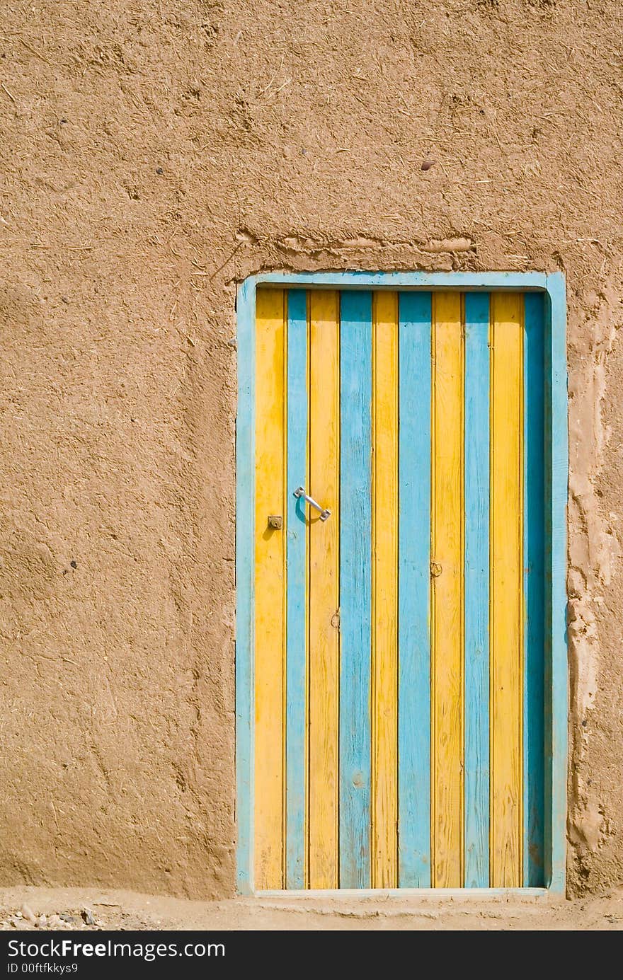 Colored door in the desert, Morocco