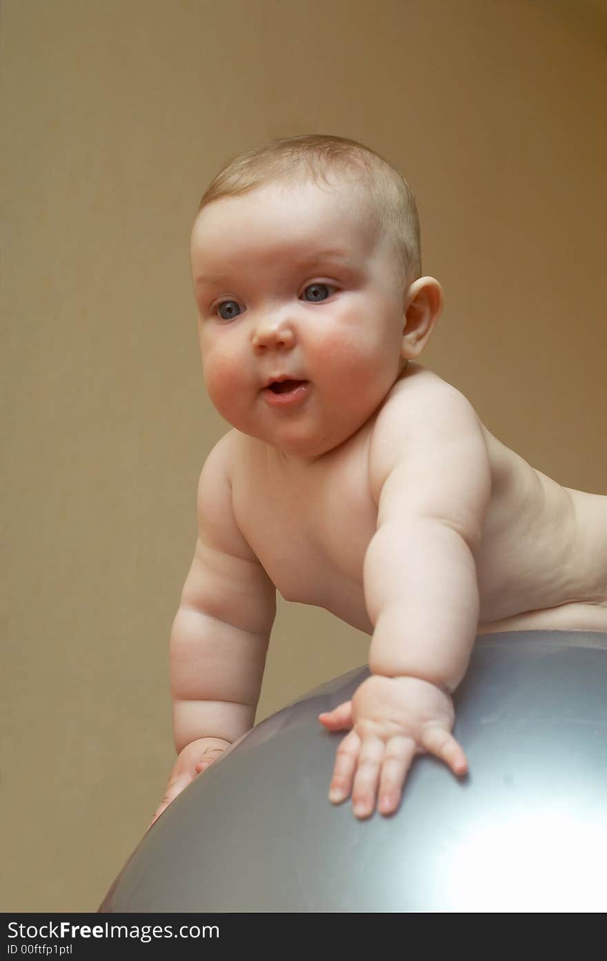 An image of a baby on the big ball. An image of a baby on the big ball