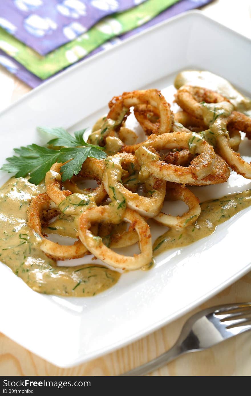 Squids in vinegar dressing with fresh herbs