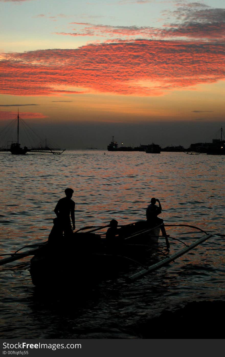 Fishermen going home during sunset. Fishermen going home during sunset.