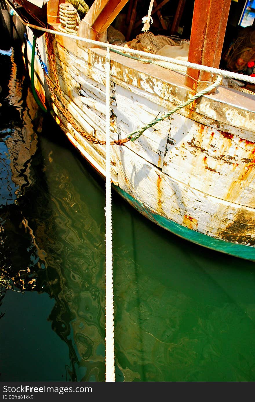 Old fishing boat in port.