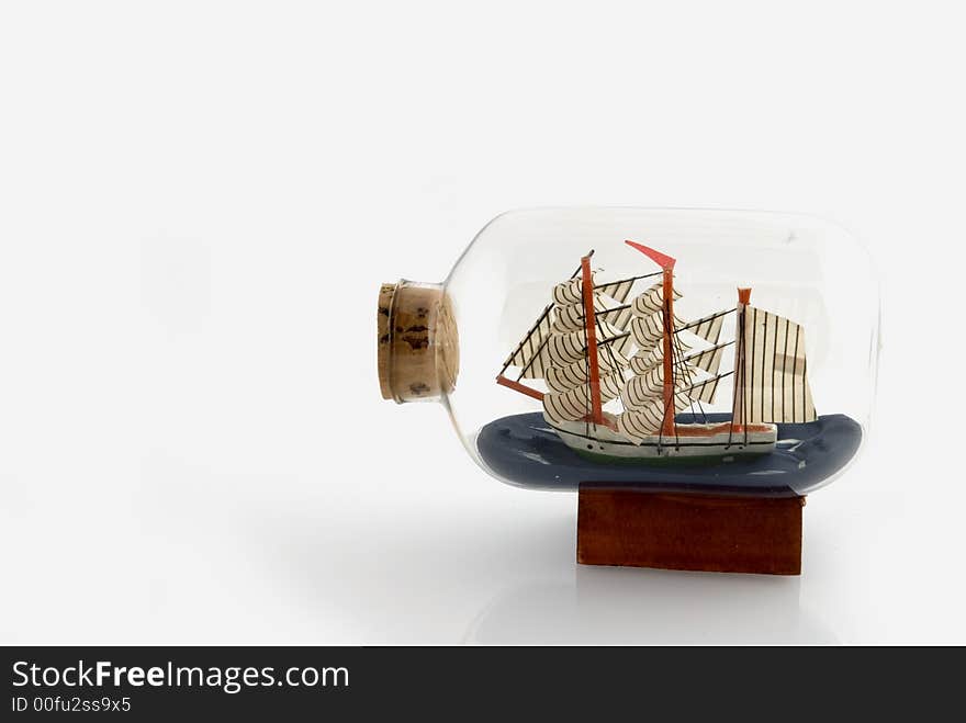 A little ship in a bottle with a cork. A little ship in a bottle with a cork