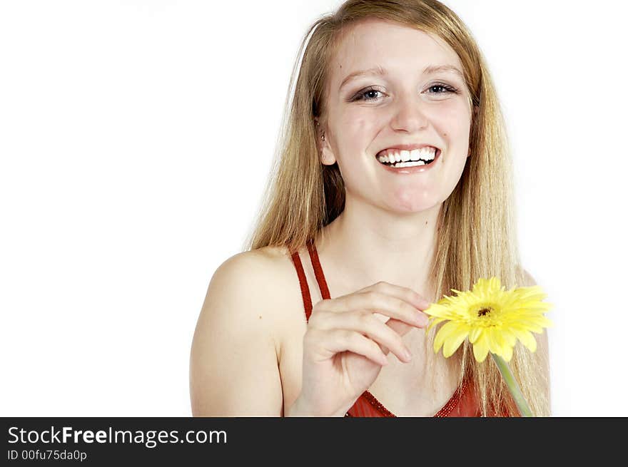 Attractive blond picking petals from a daisy. Attractive blond picking petals from a daisy