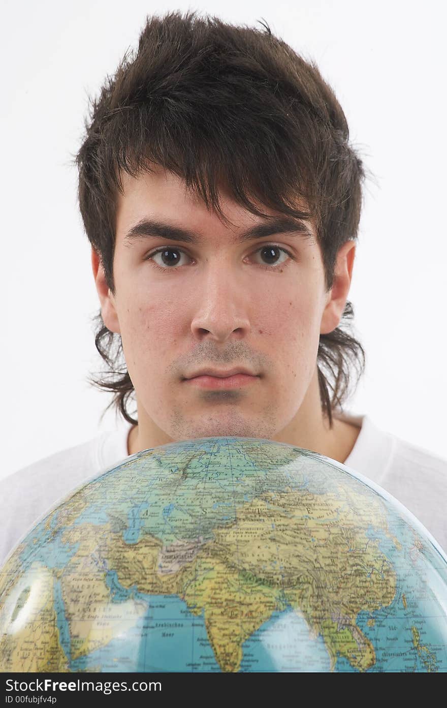 One young man with a white shirt is holding a globe. One young man with a white shirt is holding a globe