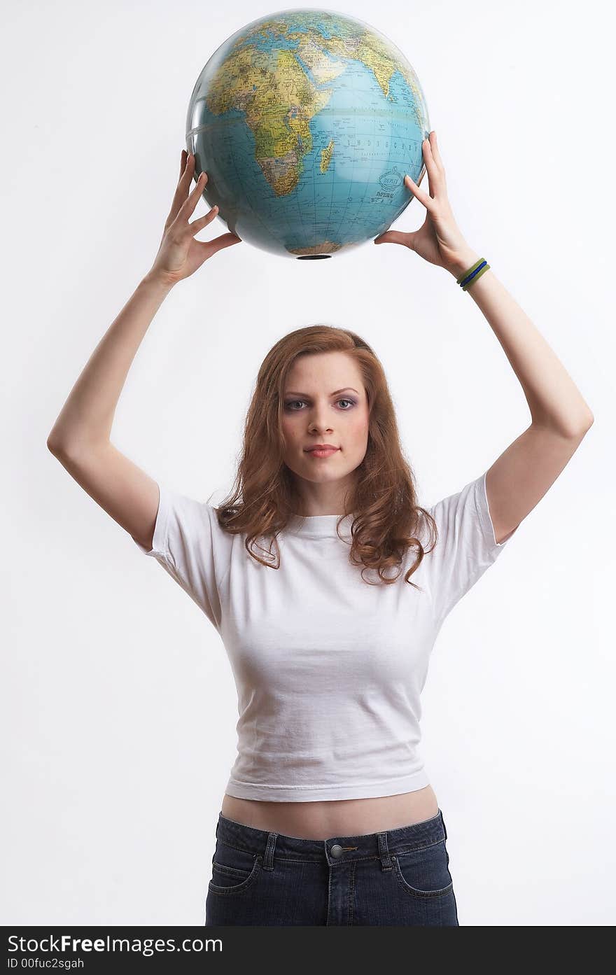 One young woman with a white shirt is holding a globe. One young woman with a white shirt is holding a globe